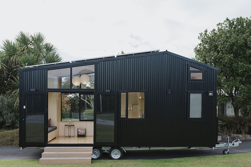 Black tiny house on wheels